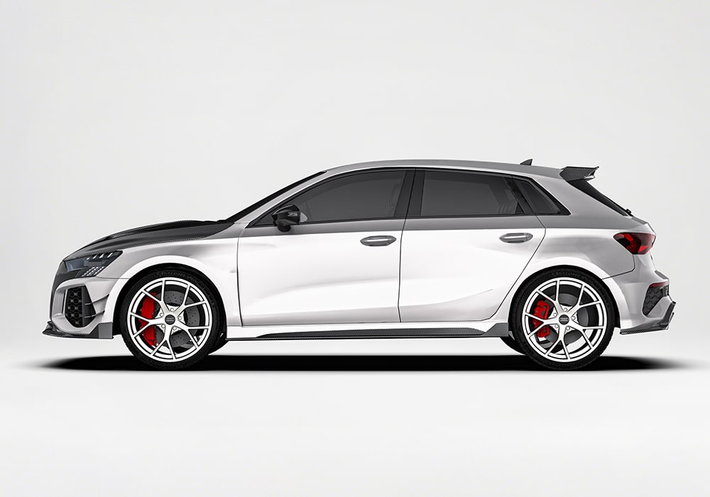 Audi RS3 (8Y) fitted with the carbon fiber aerodynamic body kit, including front splitter, side skirts, rear diffuser, and trunk spoiler, enhancing performance and styling.