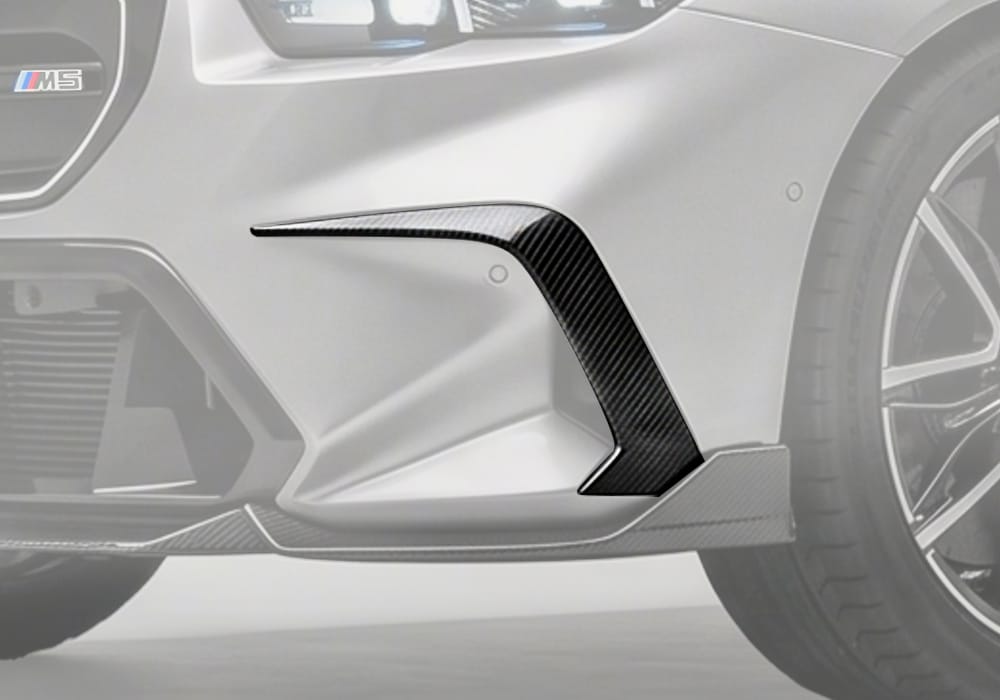 BMW M5 (G90) featuring Carbon Fiber Front Canards installed, highlighting aerodynamics and sharp styling