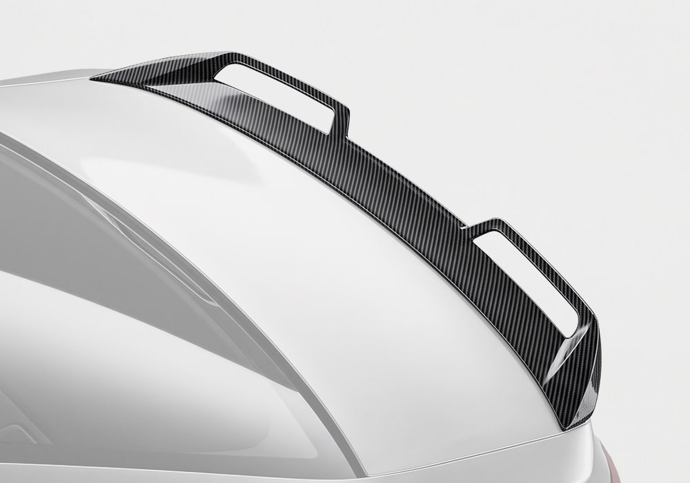 BMW M5 (G90) equipped with a Carbon Fiber Rear Spoiler, delivering an aggressive yet refined rear-end appearance