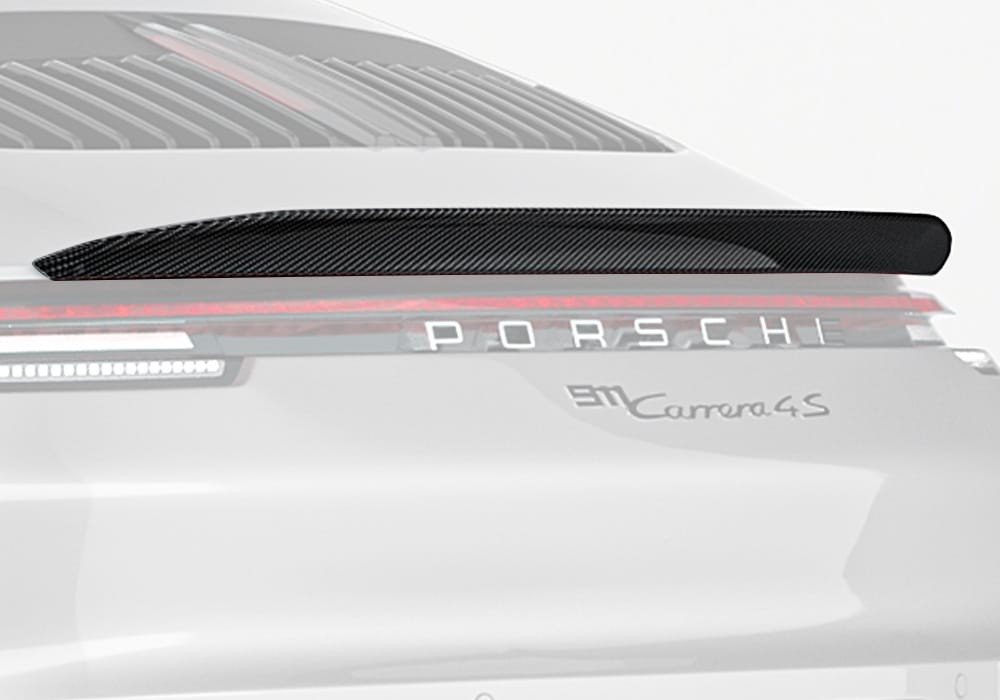 A rear view of the Porsche 911 992.1 featuring the Carbon Fiber Rear Spoiler, highlighting its seamless integration with the car's body lines and sporty appearance
