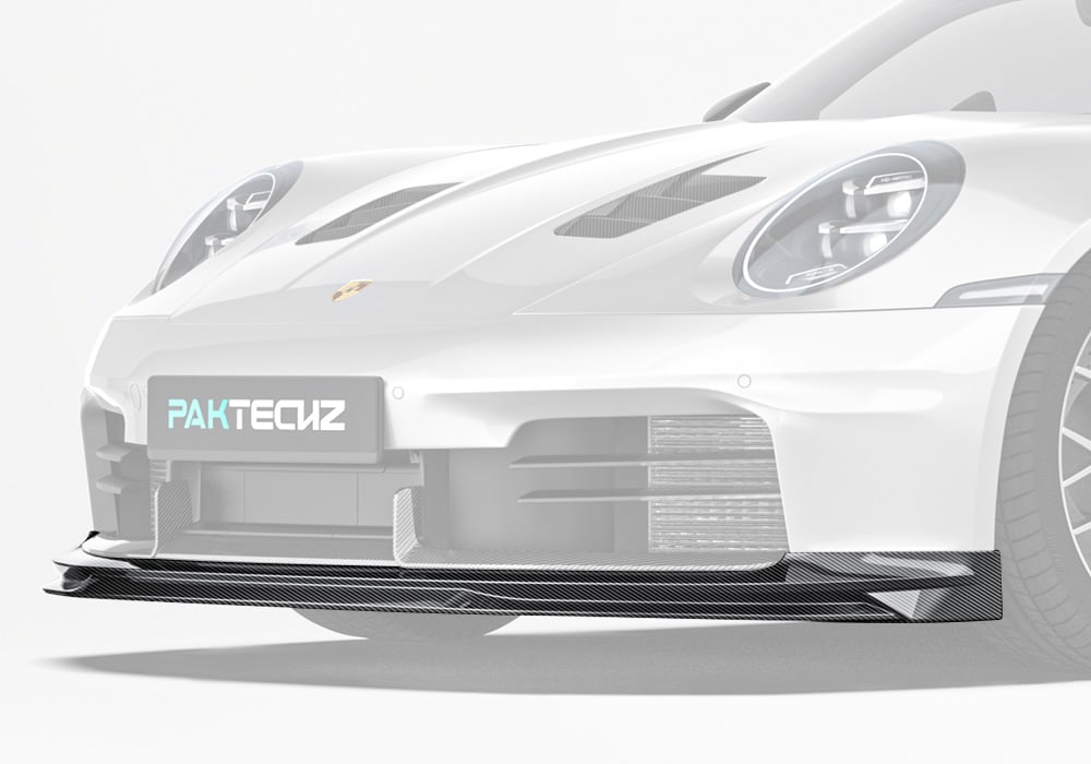 A stunning image highlighting the Carbon Fiber Front Lip integrated seamlessly into the Porsche 911’s aggressive and dynamic front-end styling