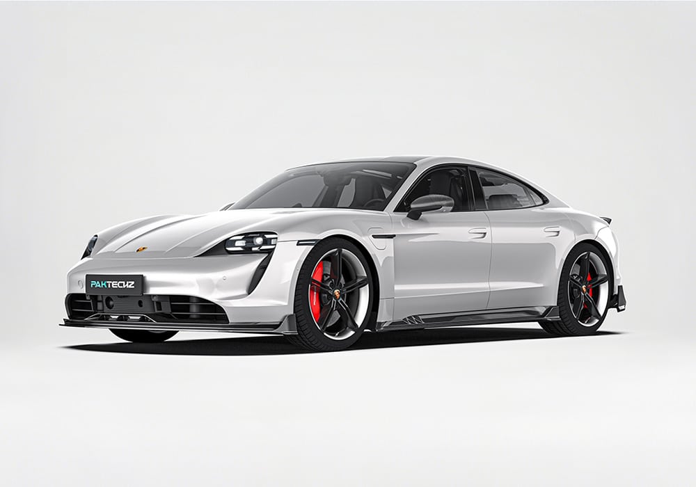 A complete visual showing the Carbon Fiber Aero Kit (front lip, side skirts, rear diffuser, rear spoiler) installed on the Taycan, showcasing its aggressive styling and aerodynamic refinement