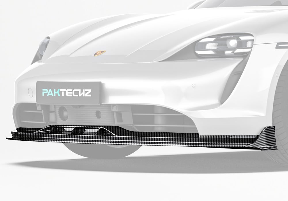 A full front profile shot showcasing the Carbon Fiber Front Lip seamlessly integrated with the Taycan’s body, emphasizing its aggressive and refined design