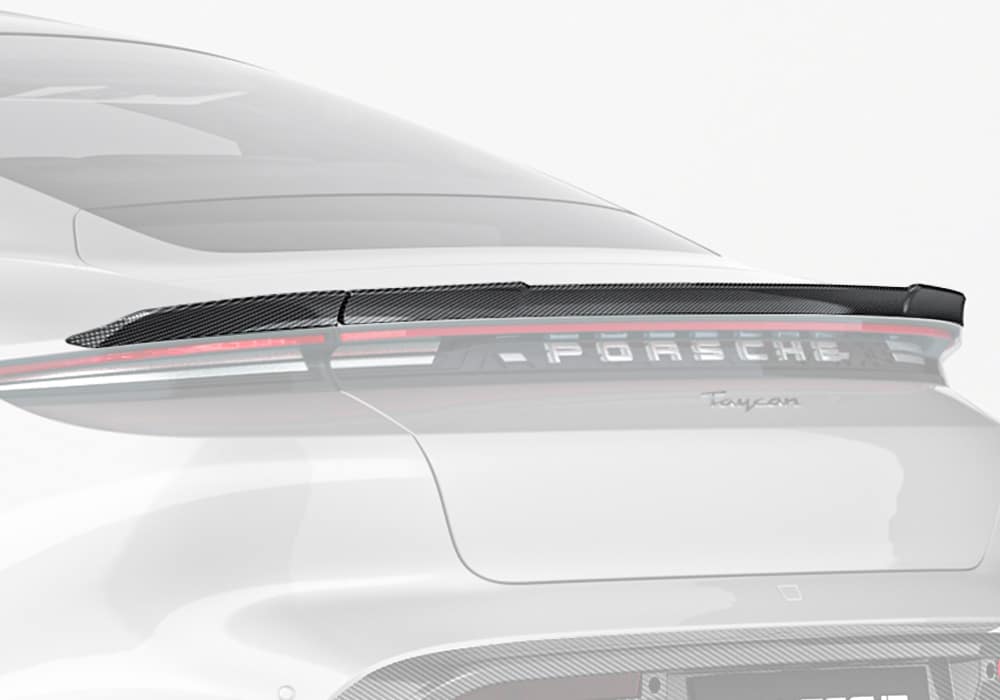 A complete rear-angle shot showcasing the Carbon Fiber Rear Spoiler seamlessly integrated into the Taycan’s factory design, emphasizing its bold styling and aerodynamic upgrade