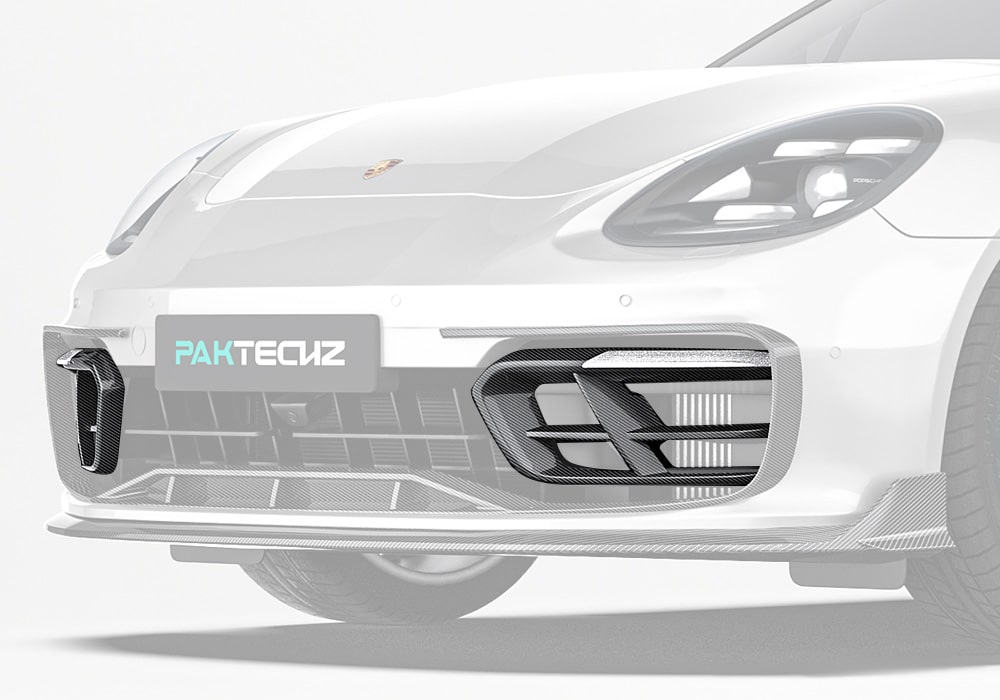 A striking front-angle shot of the Porsche Panamera showcasing the Carbon Fiber Front Air Intakes installed, blending seamlessly into the bumper design for a sharp, race-inspired aesthetic