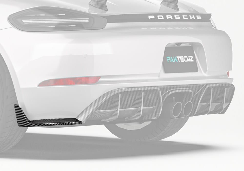 A wide-angle shot of the Porsche 718 emphasizing the bold, aggressive addition of the Carbon Fiber Rear Side Splitters integrated seamlessly into the rear bumper design