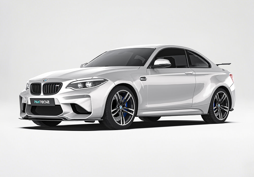 A detailed front shot of the BMW M2 F87 highlighting the aggressive carbon fiber front splitter that enhances aerodynamics and road performance