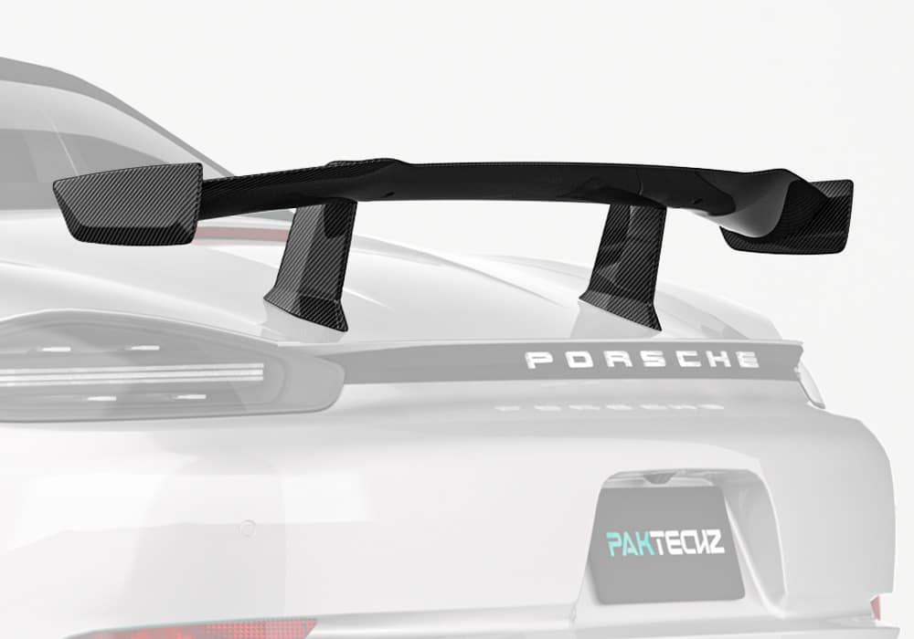 A complete rear-view shot of a Porsche 718 with the Carbon Fiber Rear Spoiler installed, showcasing its seamless integration and bold, aggressive design