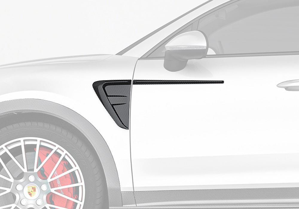 Display the seamless integration of the Carbon Fiber Fender Trims on a Porsche Cayenne, highlighting their sporty addition to the fender edges