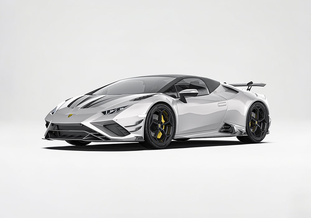 Dynamic shot highlighting the aerodynamic front splitter, seamlessly integrated into the bold curves of the Huracan EVO