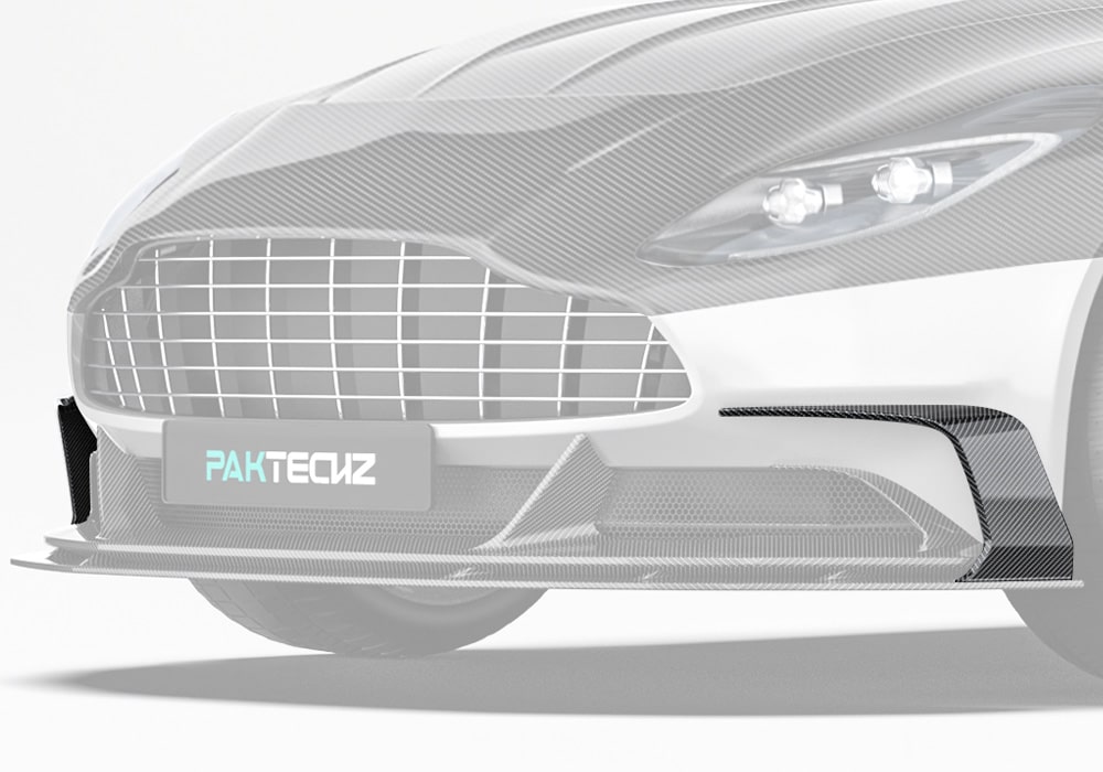 Aston Martin DB11’s front-end featuring the installed carbon fiber front canards, emphasizing the aerodynamic accents and bold styling