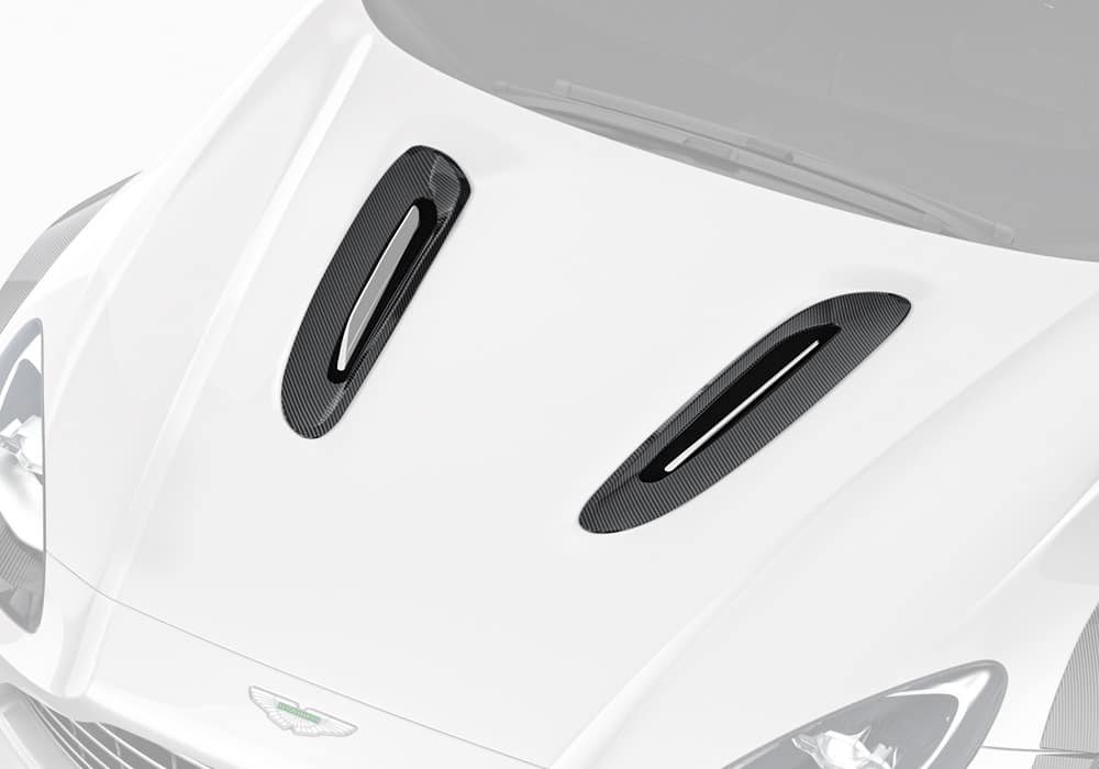 Aston Martin DBX featuring carbon fiber hood vents for enhanced airflow and cooling from a top angle