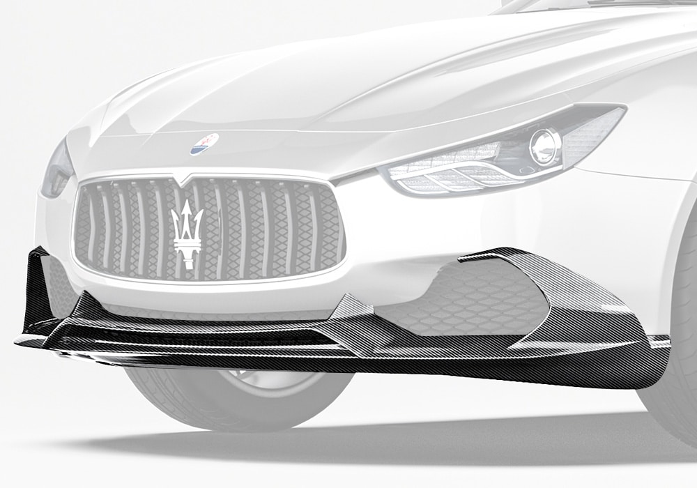 The Maserati Ghibli showcasing the elegant yet aggressive Carbon Fiber Front Lip, seamlessly integrated with its bold grille design