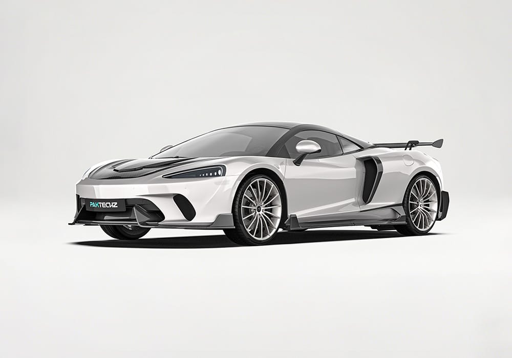 Showcasing the aggressive styling and aerodynamic boost provided by the precision-engineered carbon fiber front splitter on the McLaren GT