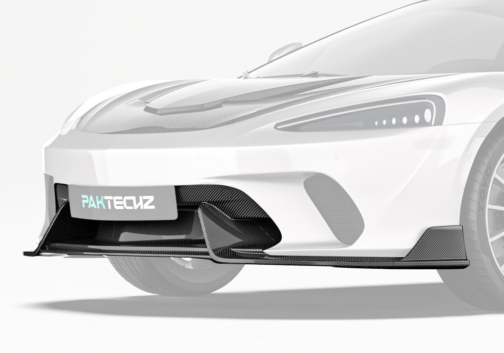 Showcasing the aggressive styling and aerodynamic enhancement of the carbon fiber front lip on the McLaren GT