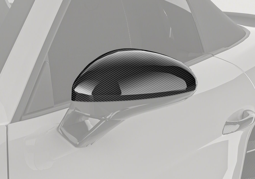 Porsche 718 outfitted with Carbon Fiber Mirror Covers showcasing enhanced luxury styling and performance-inspired design