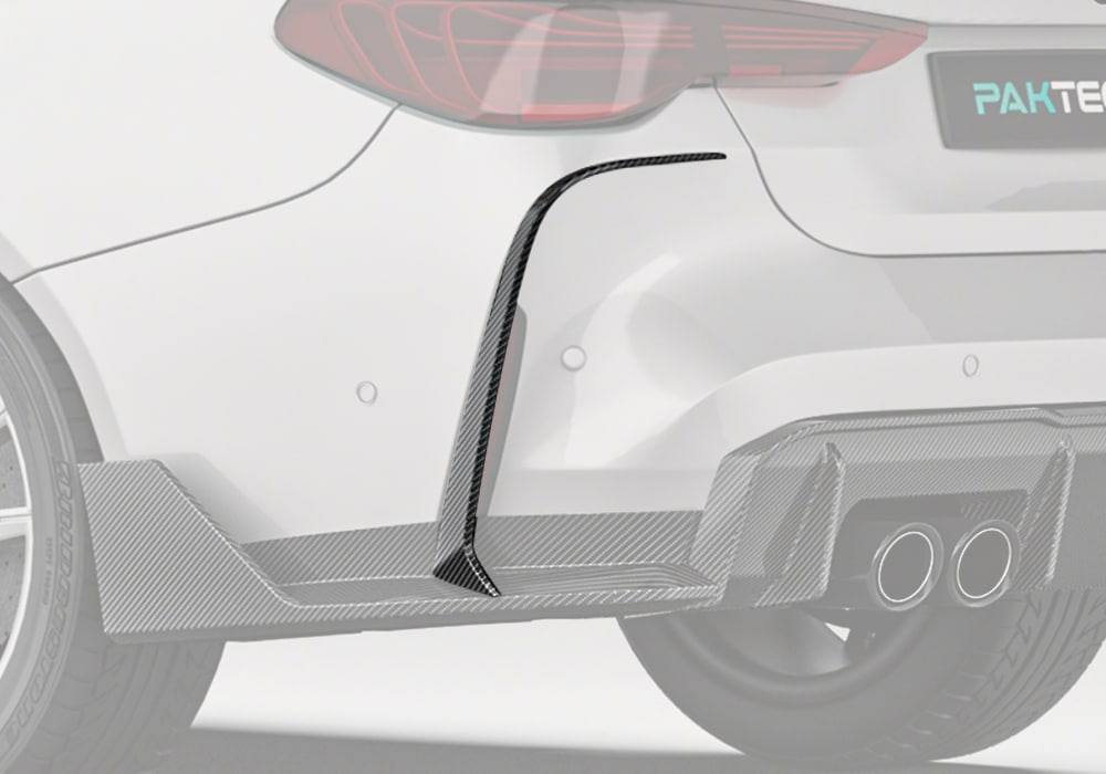A full rear-view shot of the BMW M4 G82, showcasing the seamless integration of the Carbon Fiber Rear Canards with the bumper design