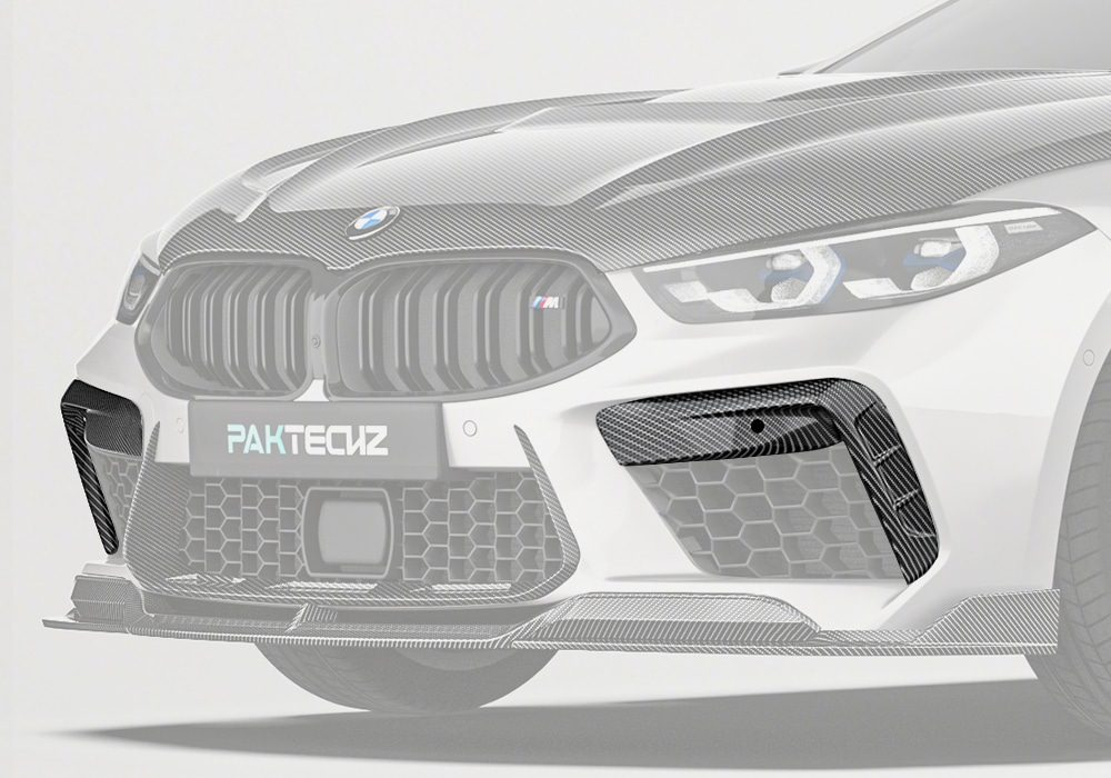 An all-encompassing shot of the BMW M8 F93’s front bumper, displaying how the Carbon Fiber Front Canards dramatically enhance its sporty appearance