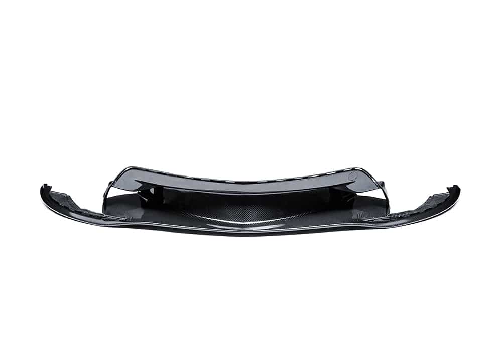 Showcasing the aggressive styling and aerodynamic enhancement of the carbon fiber front lip on the McLaren GT