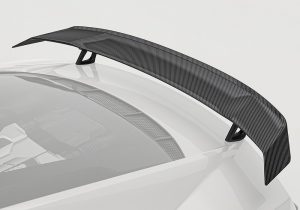 Full rear view of the Audi R8 showcasing the aggressive aesthetic and clean integration of the carbon fiber rear wing for a bold profile.