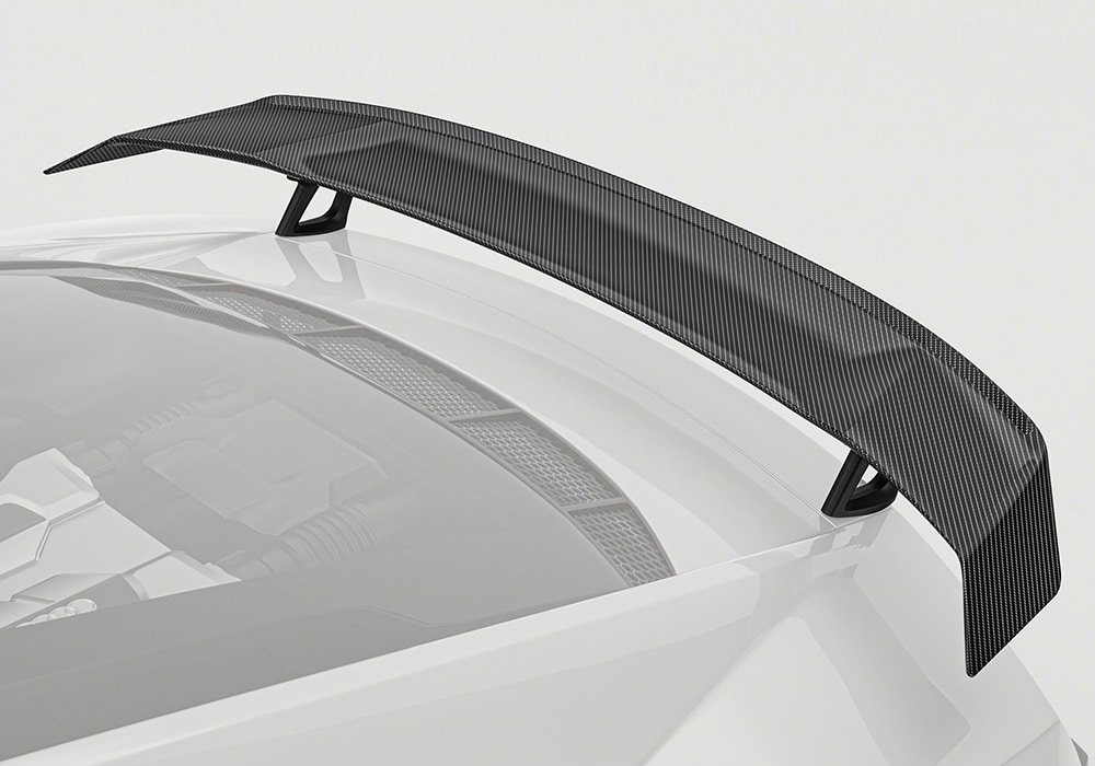 Full rear view of the Audi R8 showcasing the aggressive aesthetic and clean integration of the carbon fiber rear wing for a bold profile.