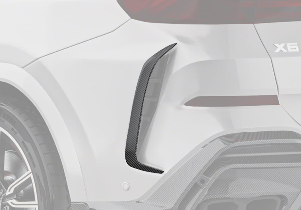 A clear rear-view image highlighting the sleek integration of the Carbon Fiber Rear Canards into the dynamic lines of the BMW X6 G06