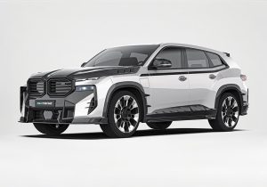 A complete image of the BMW XM G09 outfitted with the Carbon Fiber Aero Kit, showcasing the integrated front splitter, side skirts, and rear diffuser in high-gloss carbon fiber