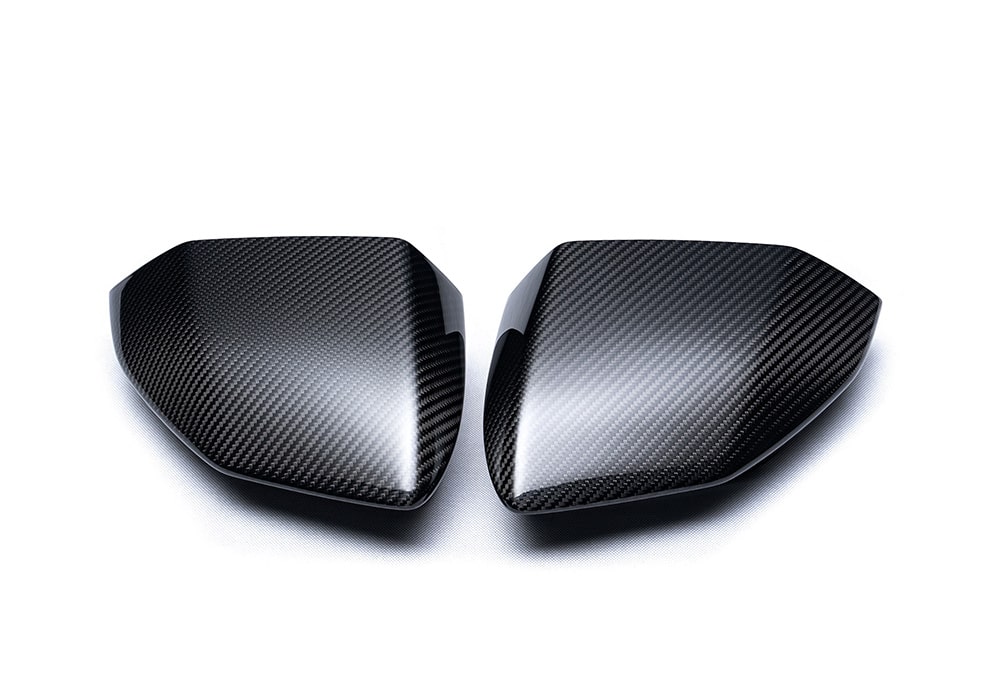Full side profile of Lamborghini Revuelto with Carbon Fiber Mirror Covers installed for a premium, sporty look