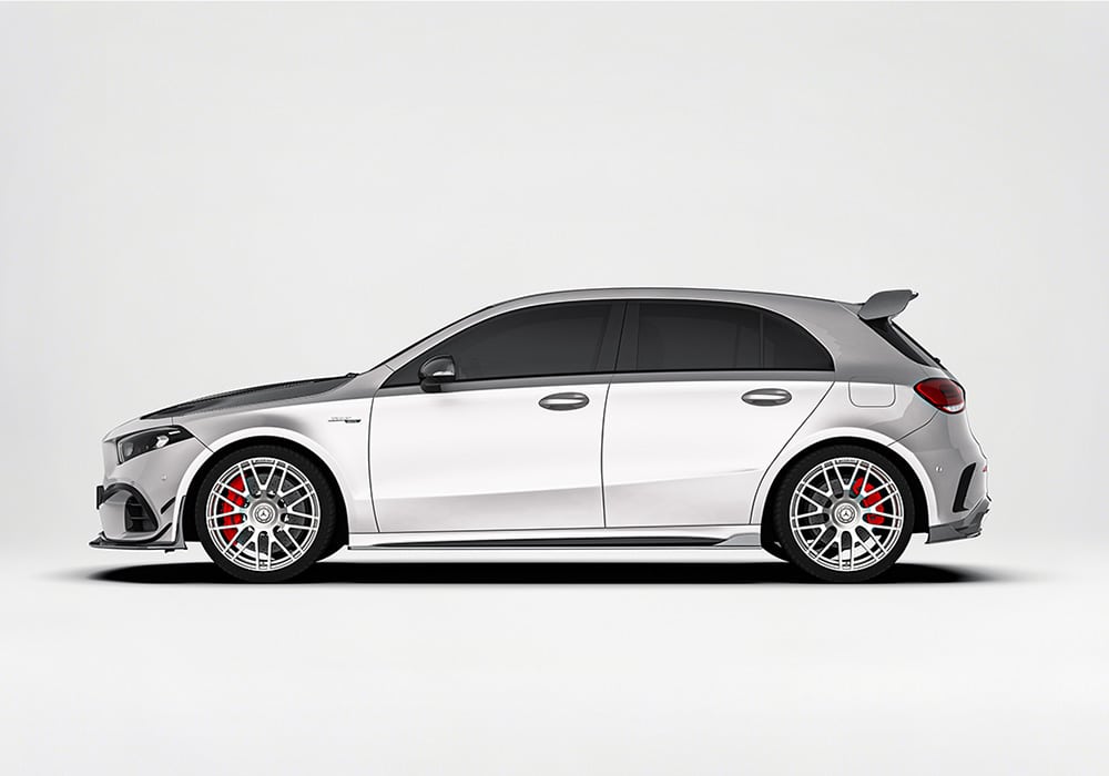A detailed side-angle shot showcasing how the Carbon Fiber Side Skirts integrate seamlessly with the car’s body for improved side airflow