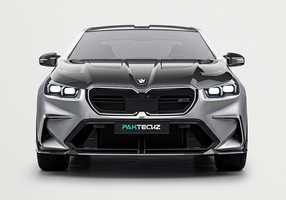 Close-up detail of the carbon fiber front lip spoiler on a BMW M5 (G90), highlighting the precision weave and premium glossy finish