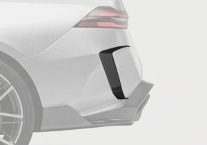Close-up view of BMW M5 (G90) Carbon Fiber Rear Canards showing the 2x2 twill weave carbon fiber and glossy finish