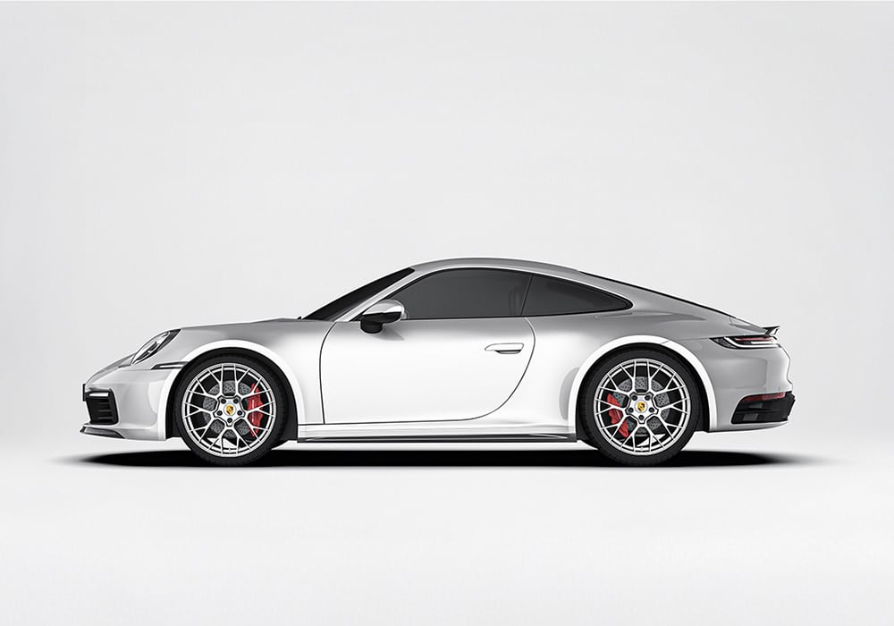 A detailed view of the Carbon Fiber Front Lip and Side Skirts, highlighting their lightweight design, sharp contours, and aerodynamic integration with the car's body