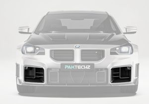 High-resolution close-up image highlighting the carbon fiber weave and precision manufacturing of the front air ducts for durability and premium styling