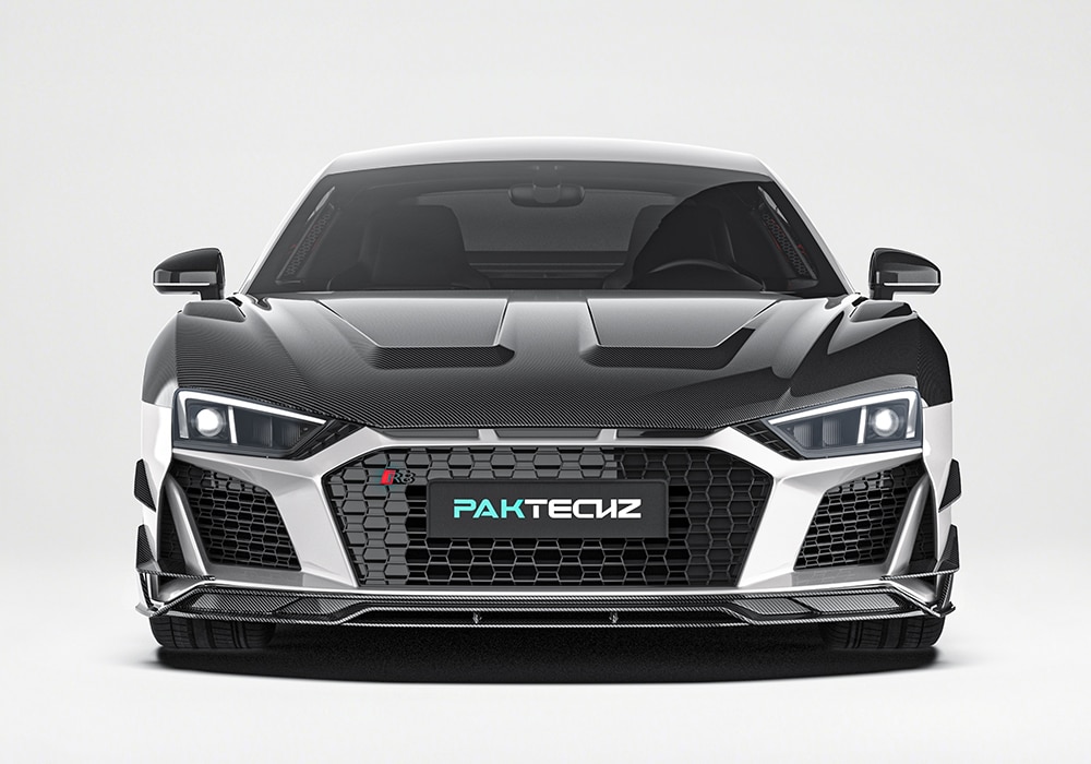 Premium carbon fiber weave texture displayed on the rear diffuser and wing spoiler, emphasizing craftsmanship and material quality