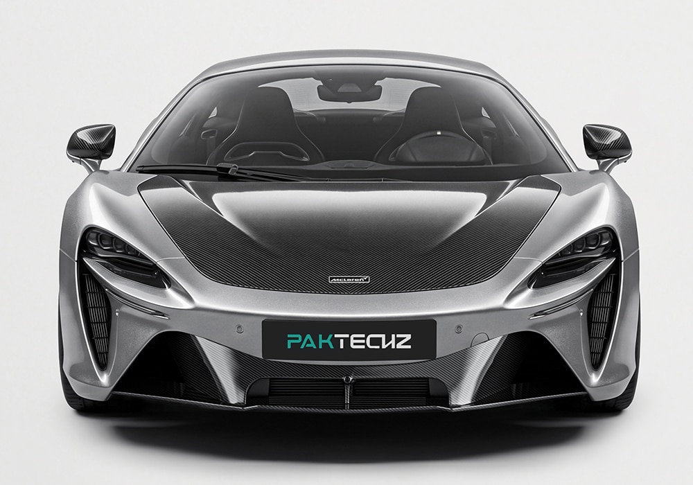 Close-up of the McLaren Artura front splitter showcasing the high-gloss carbon fiber finish