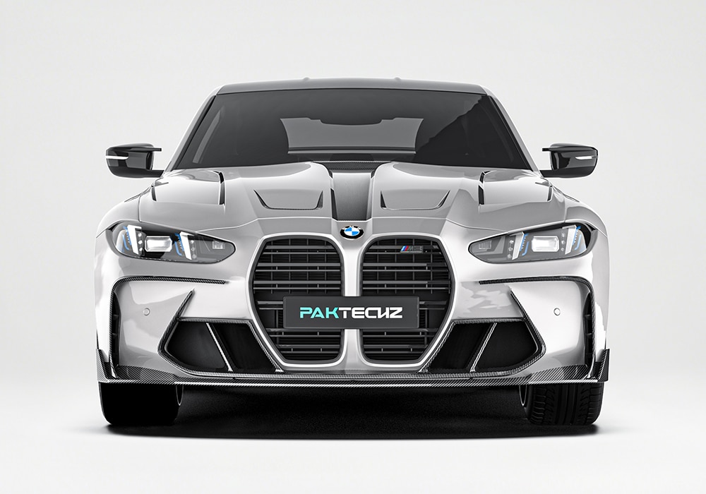 A detailed view of the carbon fiber front lip and canards, highlighting the sharp contours, aggressive styling, and precision fitment on the M4