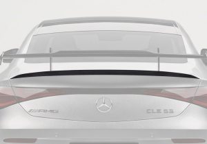 Detailed shot of the 3K twill weave carbon fiber, showcasing the exceptional craftsmanship and high-gloss finish of the trunk spoiler