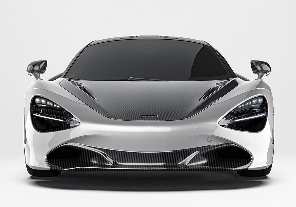 Close-up of McLaren 720S Carbon Fiber Front Lip, highlighting aerodynamic fins and premium finish