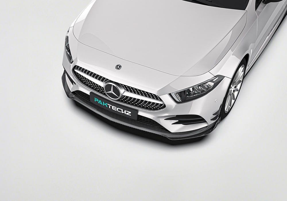 A sharp side-angle view of the vehicle with the carbon fiber side skirts, emphasizing their aerodynamic functionality and aesthetics