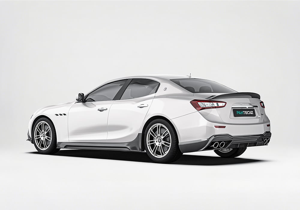 Maserati Ghibli captured from a side perspective, displaying how the carbon fiber side skirts create a seamless profile with the car’s body