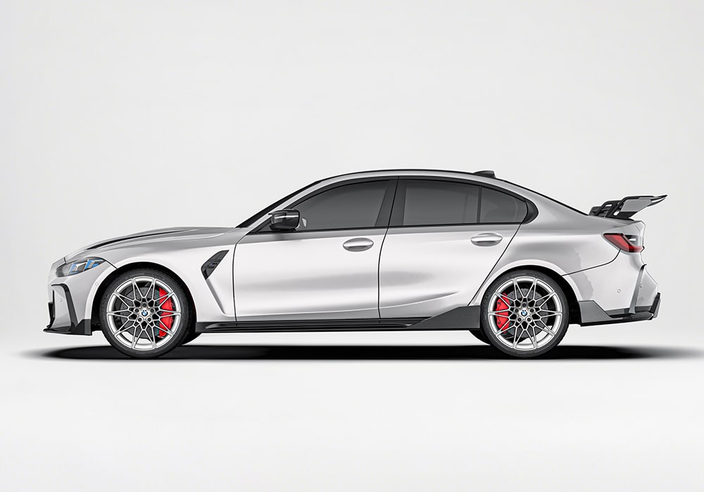 A side-angle image showcasing the sleek carbon fiber side skirts, emphasizing improved airflow at high speeds