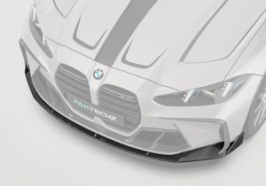 A three-quarter angle image that highlights the seamless integration of the Carbon Fiber Front Lip with the BMW M4 G82/G83’s front bumper design