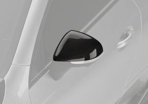 Action shot of the CLE53, featuring the sleek carbon fiber mirror covers while on the road, adding a polished look to every drive