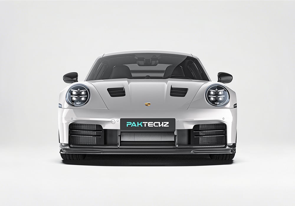 The Porsche 911 992.2 equipped with the Carbon Fiber Aero Kit, performing on a professional race track, emphasizing improved handling and speed