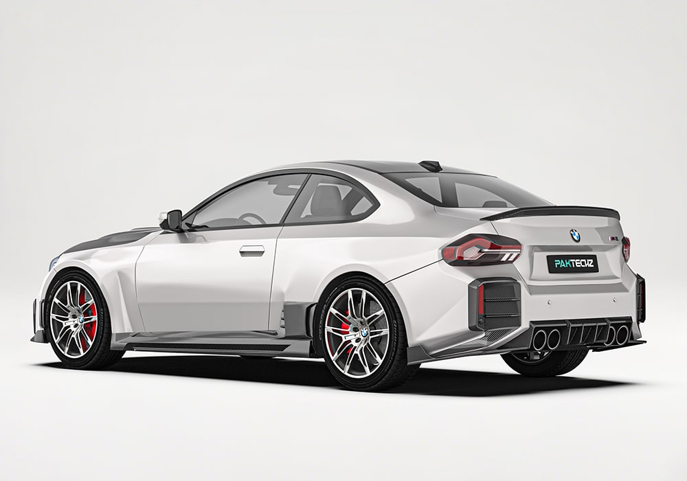 Side-angle view showing how the Carbon Fiber Side Skirts streamline airflow along the M2 G87’s sides for reduced drag and increased stability