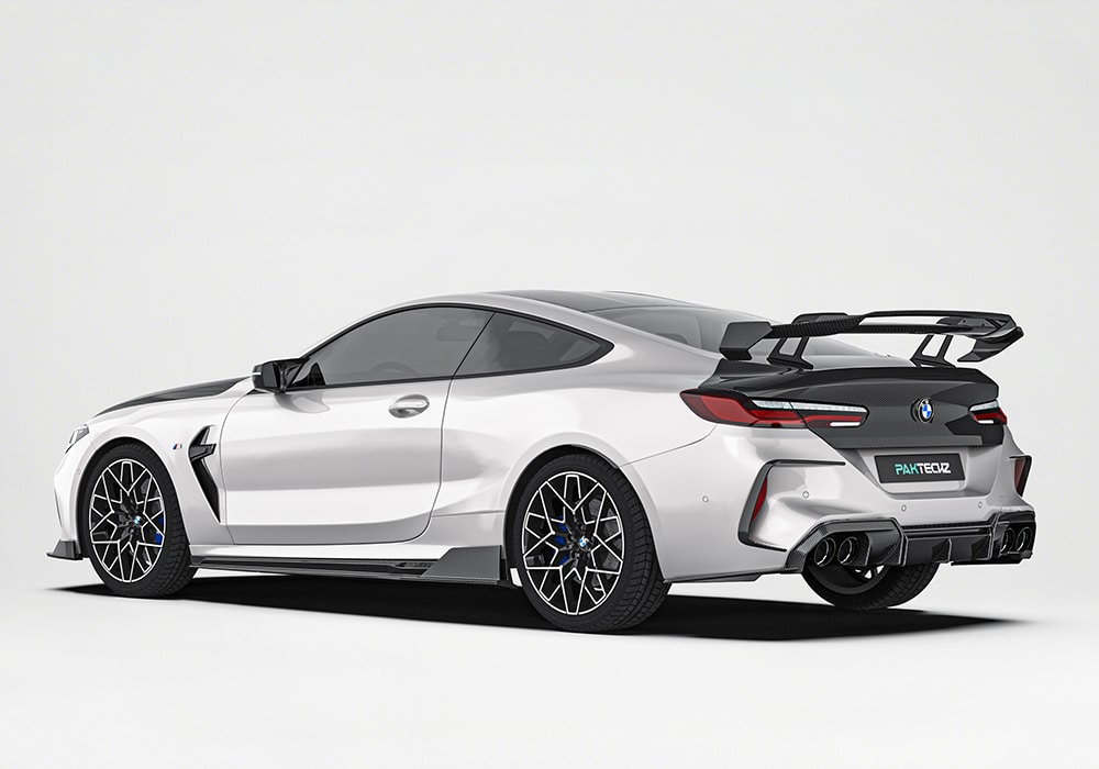 Close-up of the carbon fiber rear diffuser, emphasizing the aggressive fins that optimize airflow while completing the M8’s sportive rear aesthetic