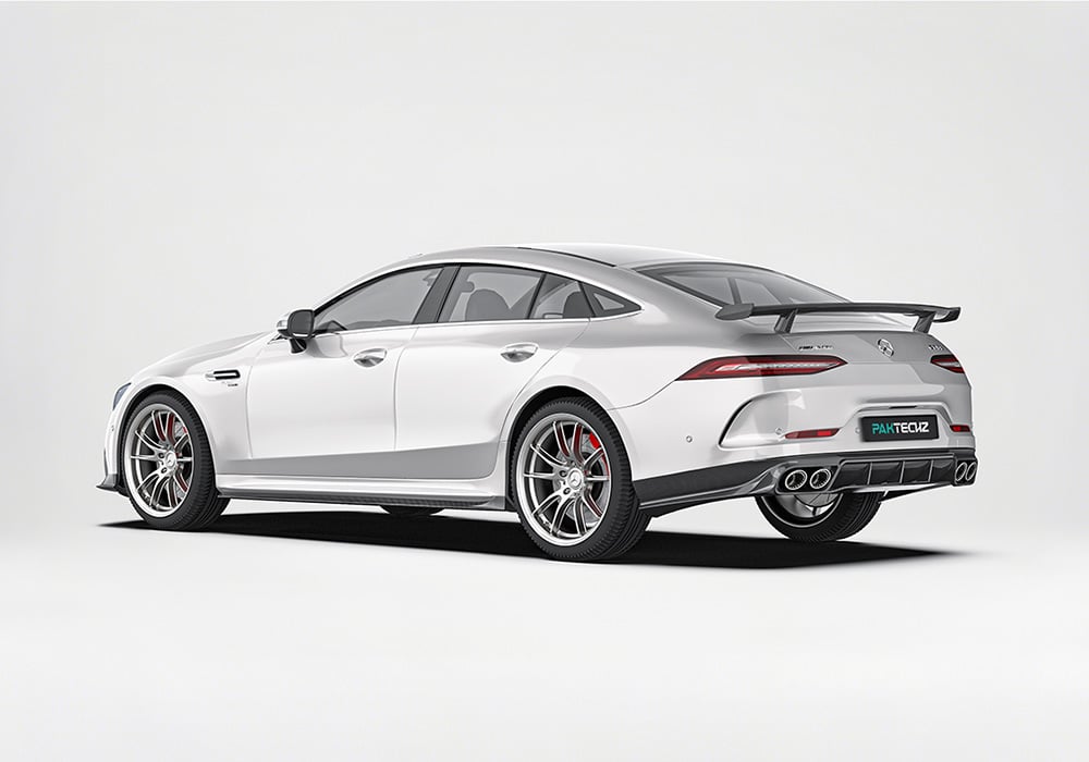 A vivid action photo of the AMG GT43, equipped with the aerodynamics kit, racing through open highways while emphasizing both performance enhancements and visual refinement