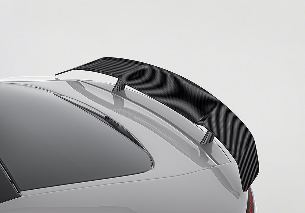 A dynamic side shot of the AMG GT/GTS C190 fitted with Carbon Fiber Side Skirts, driving on a highway to showcase the aerodynamic and visual impact during motion.