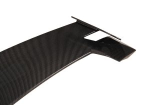 Technician installing the Lamborghini Urus Carbon Fiber Roof Spoiler, demonstrating precision fitment and easy alignment