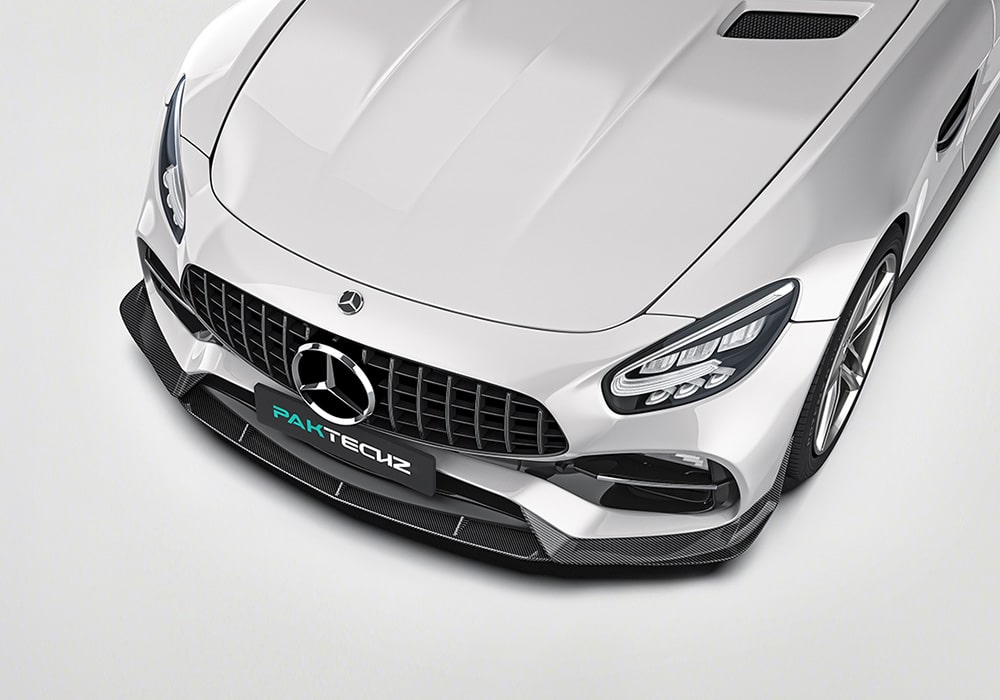 A dynamic side shot of the AMG GT/GTS C190 fitted with Carbon Fiber Side Skirts, driving on a highway to showcase the aerodynamic and visual impact during motion